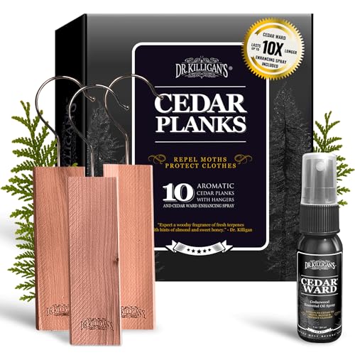 Tre små vertikale sedertreplanker med opphengskroker foran en svart boks og spray