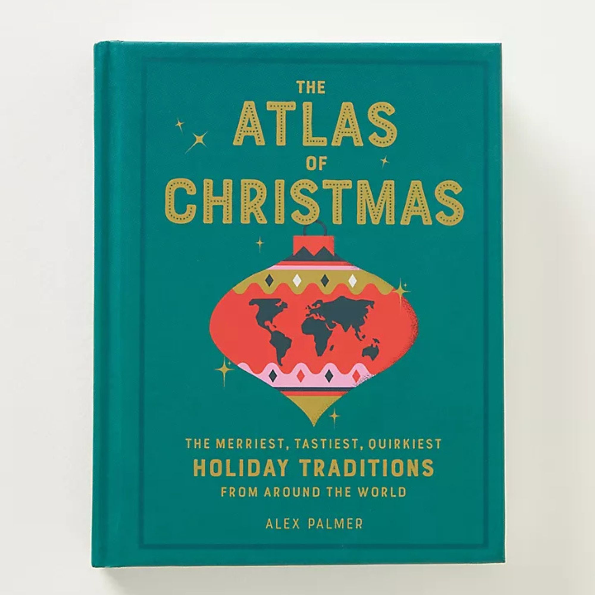 The Atlas of Christmas bok mot en hvit bakgrunn.