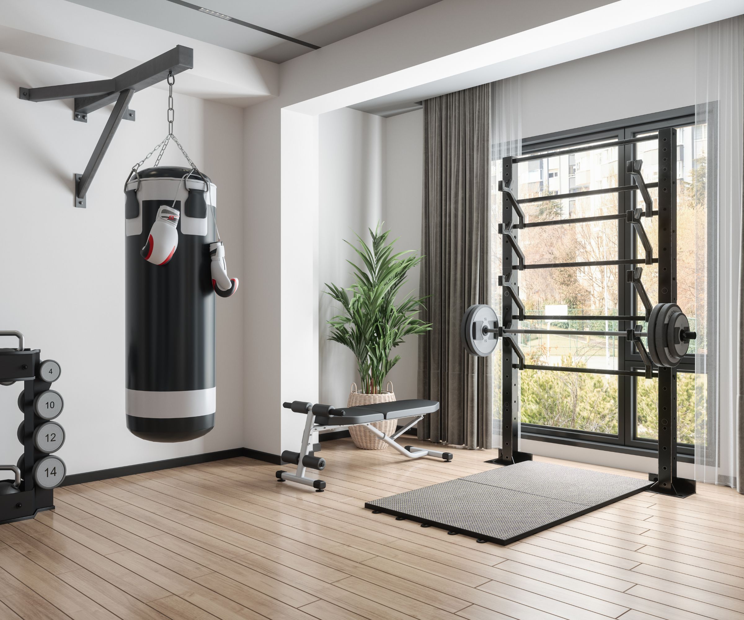 Et hjemmegym i et hvitt rom med svart treningsutstyr