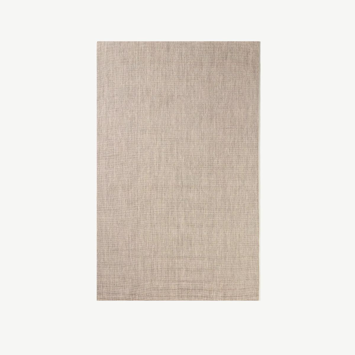Et beige teppe